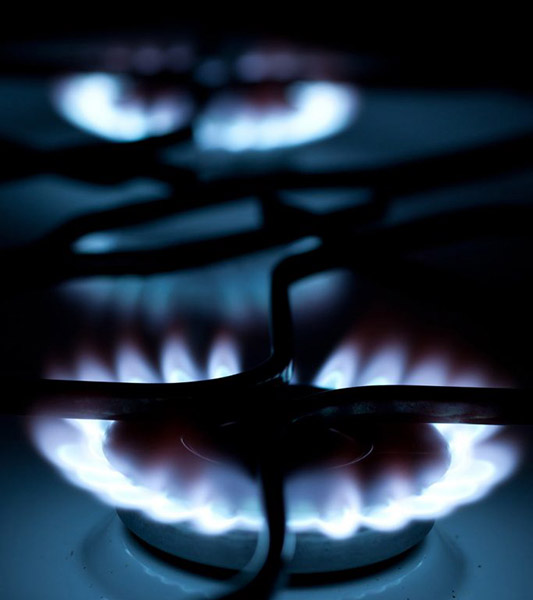 Two gas burners on a stove | Featured image on Gas Plumber.