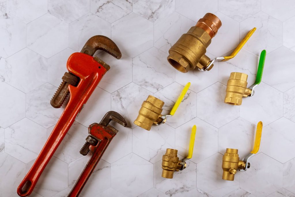 Tools and parts associated with plumbing leak repair | Featured image for the Plumbing Repair Services Page from Akins Plumbing.